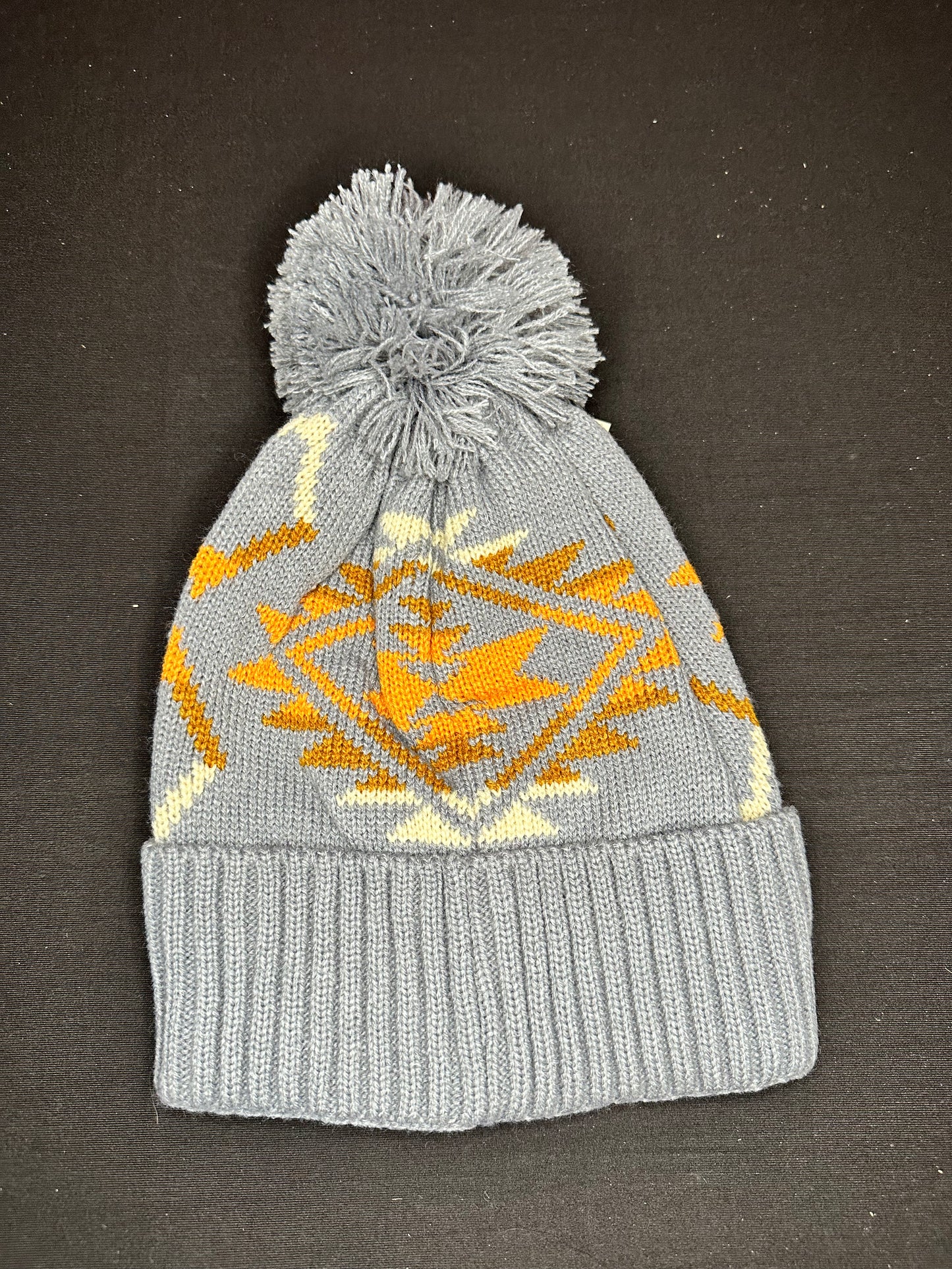 Grey beanie either orange and white Aztec print and Pom Pom on top