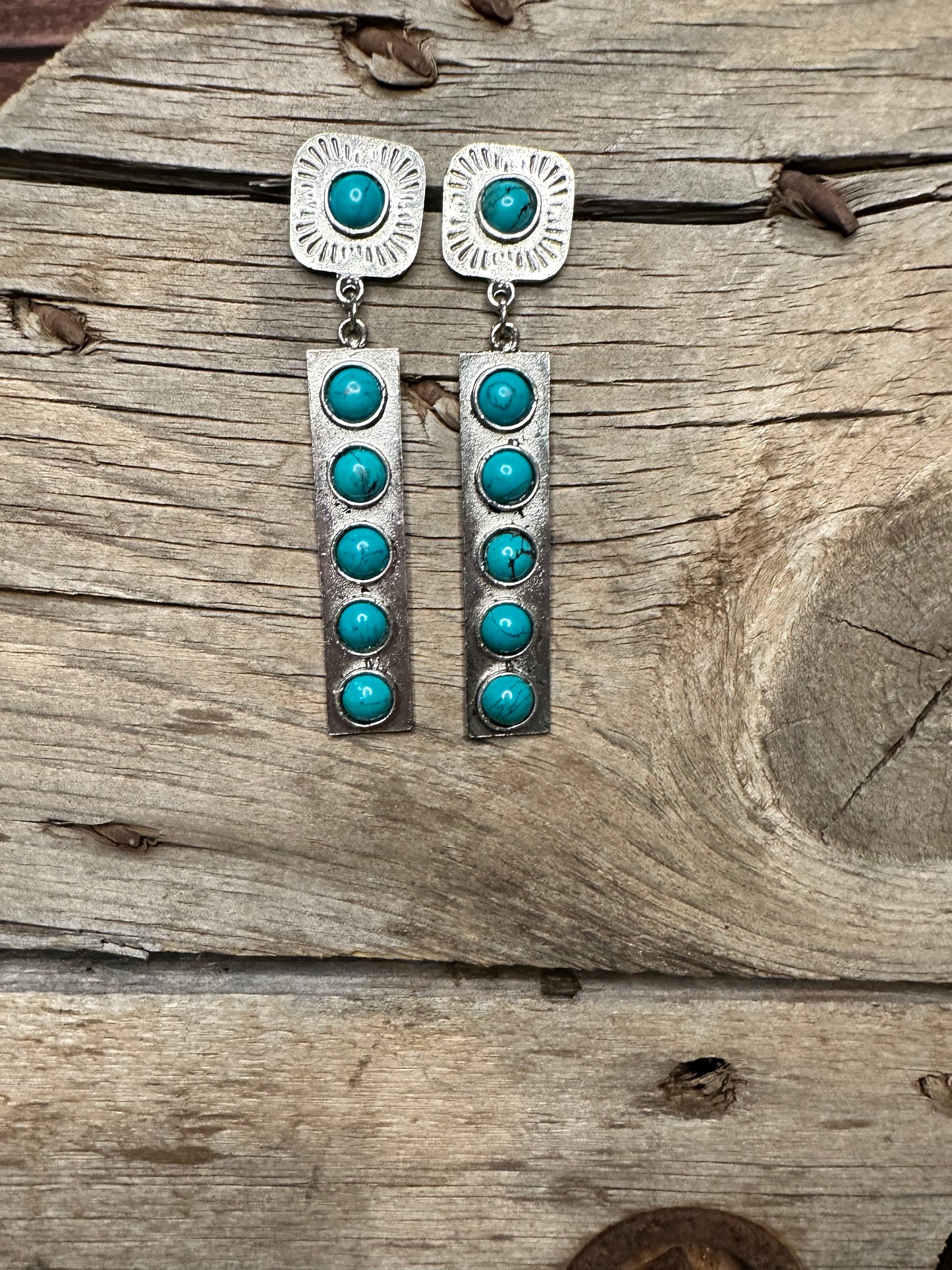 Silver dangle earrings with turquoise stones