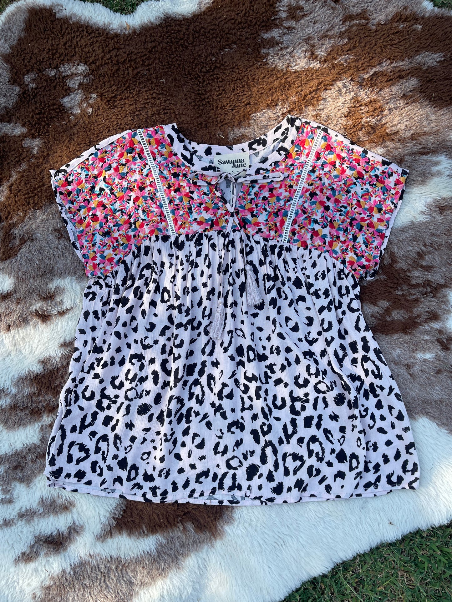 black and white cheetah blouse with colorful embroidery and tassel tie