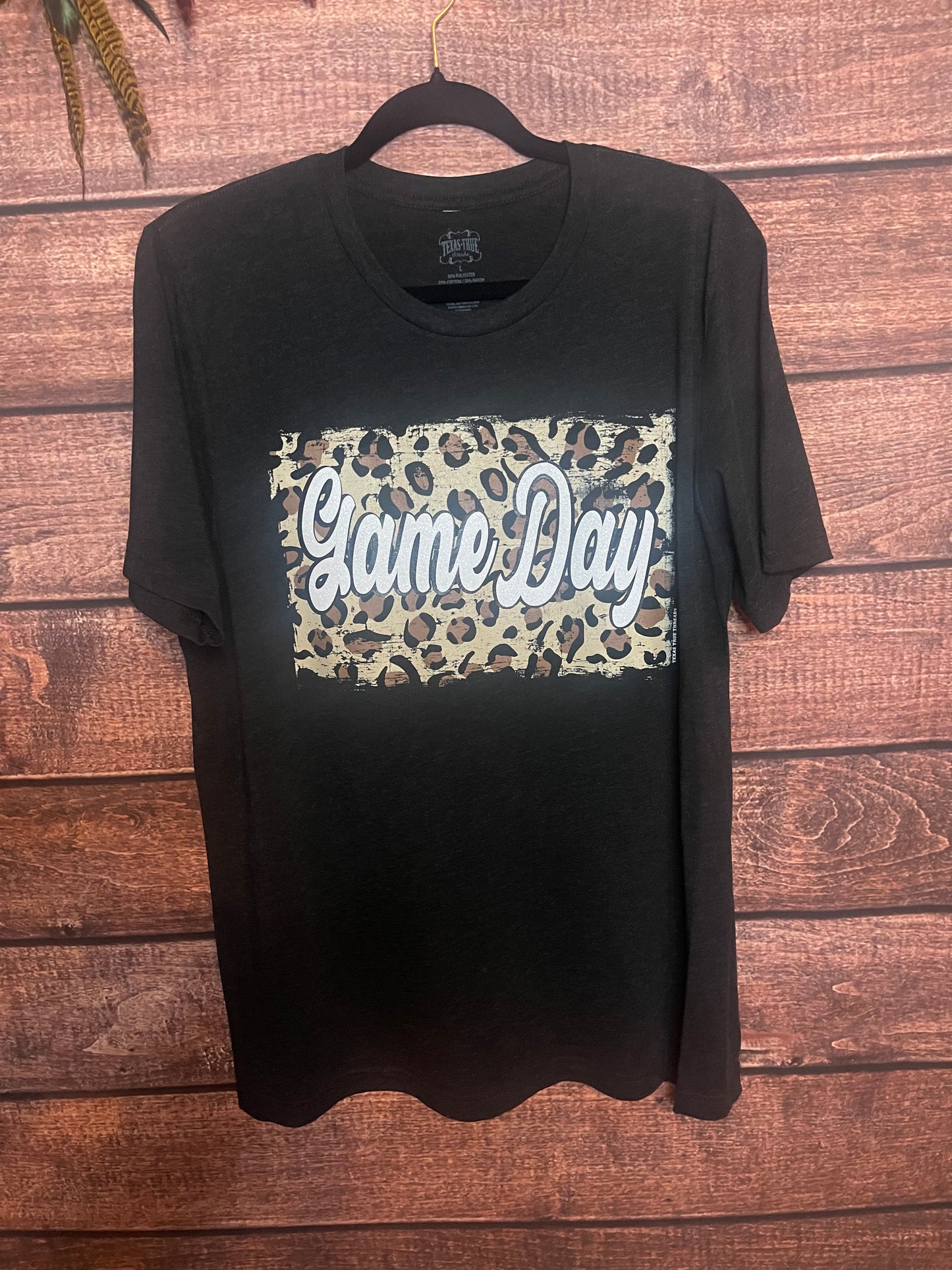 black t-shirt with Cheetah back ground and white glitter letters that spell out Game Day