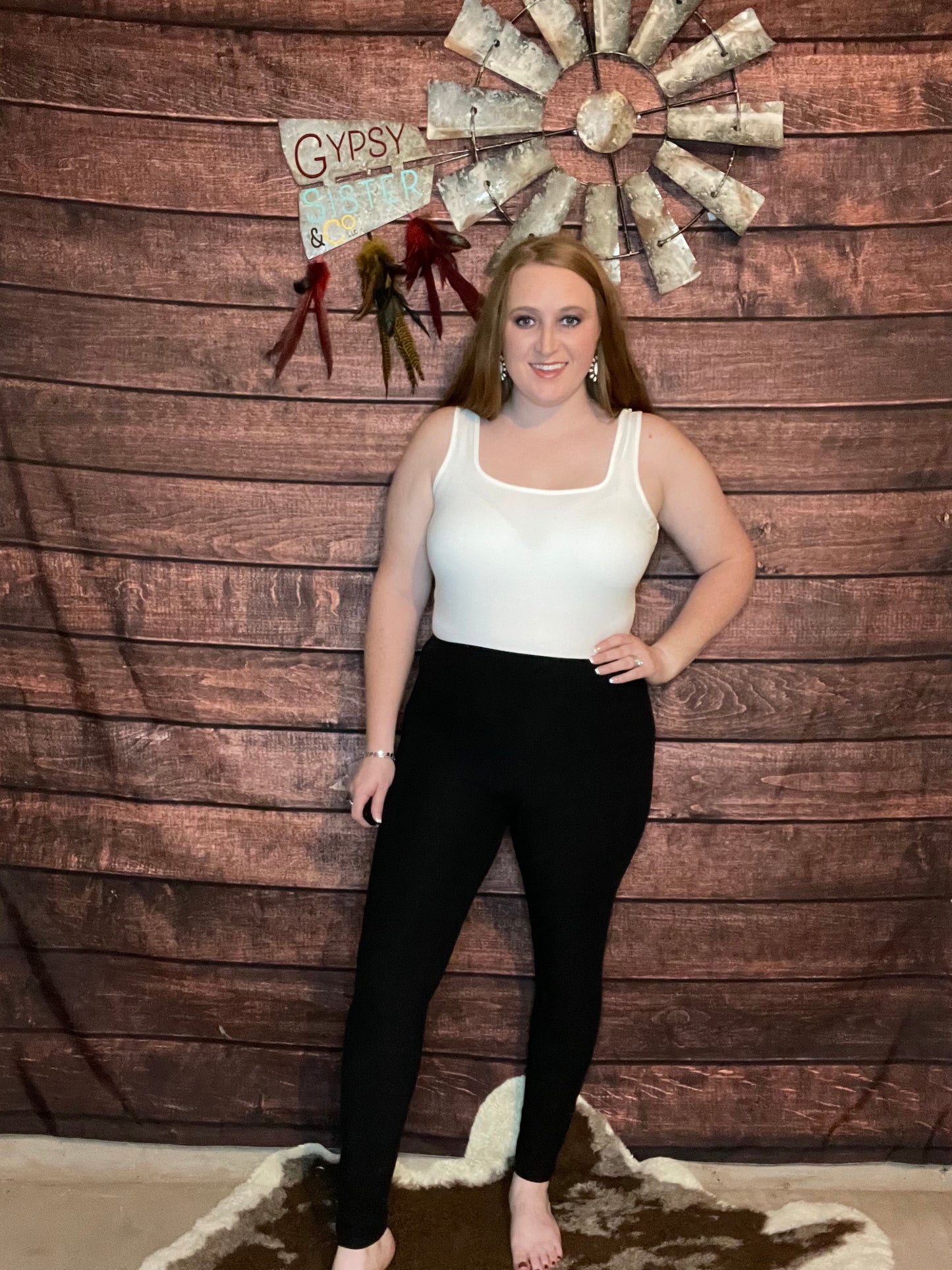 Model wearing black full length leggings with pockets