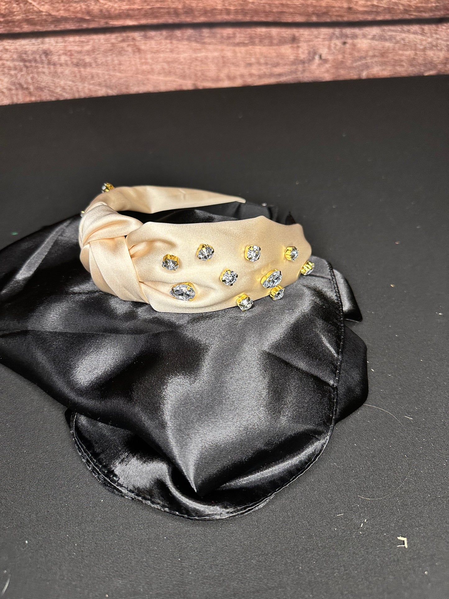 Cream colored silky headband with rhinestone beading