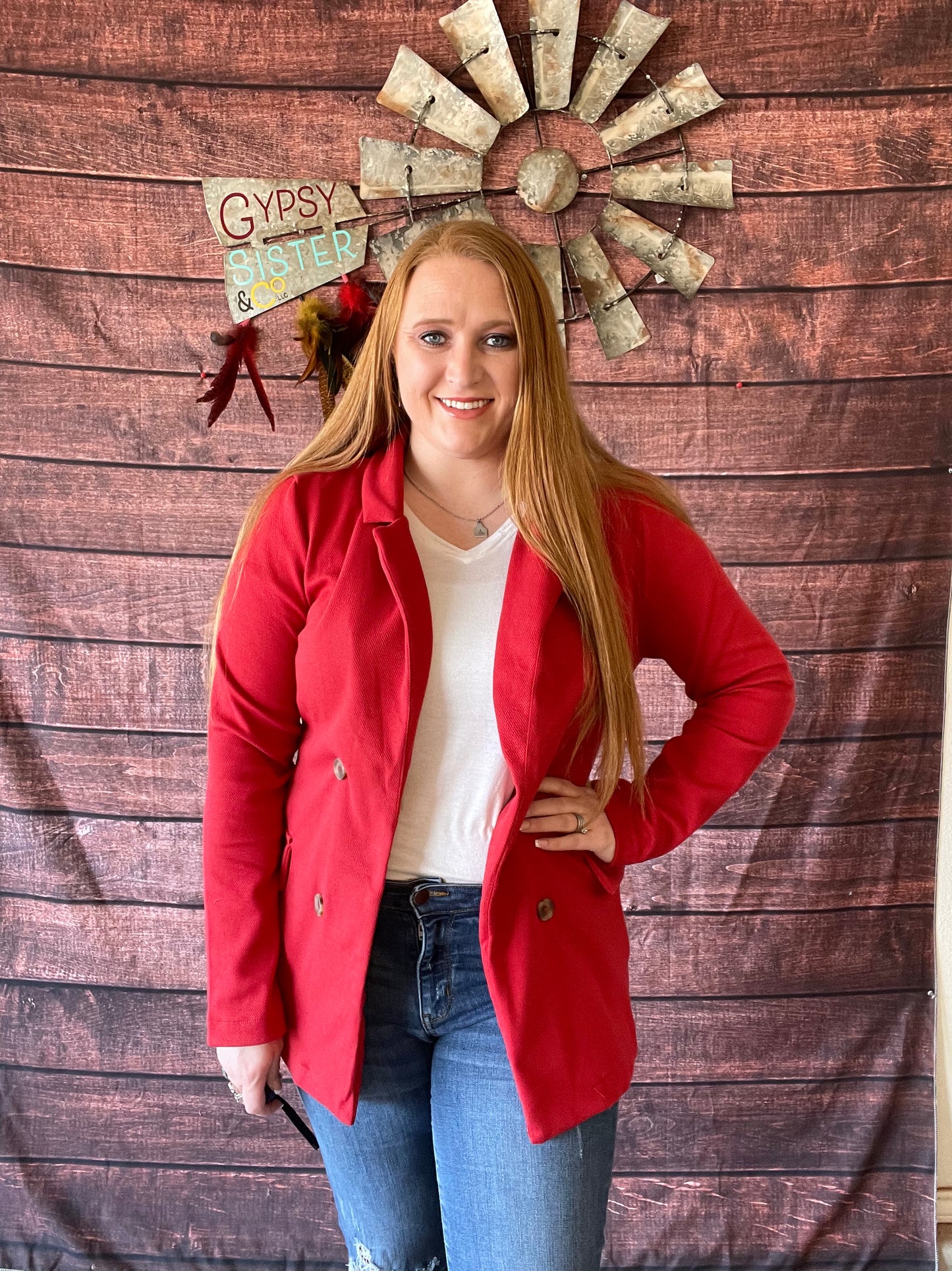 Model wearing Queen Red ribbed cotton blazer in size large