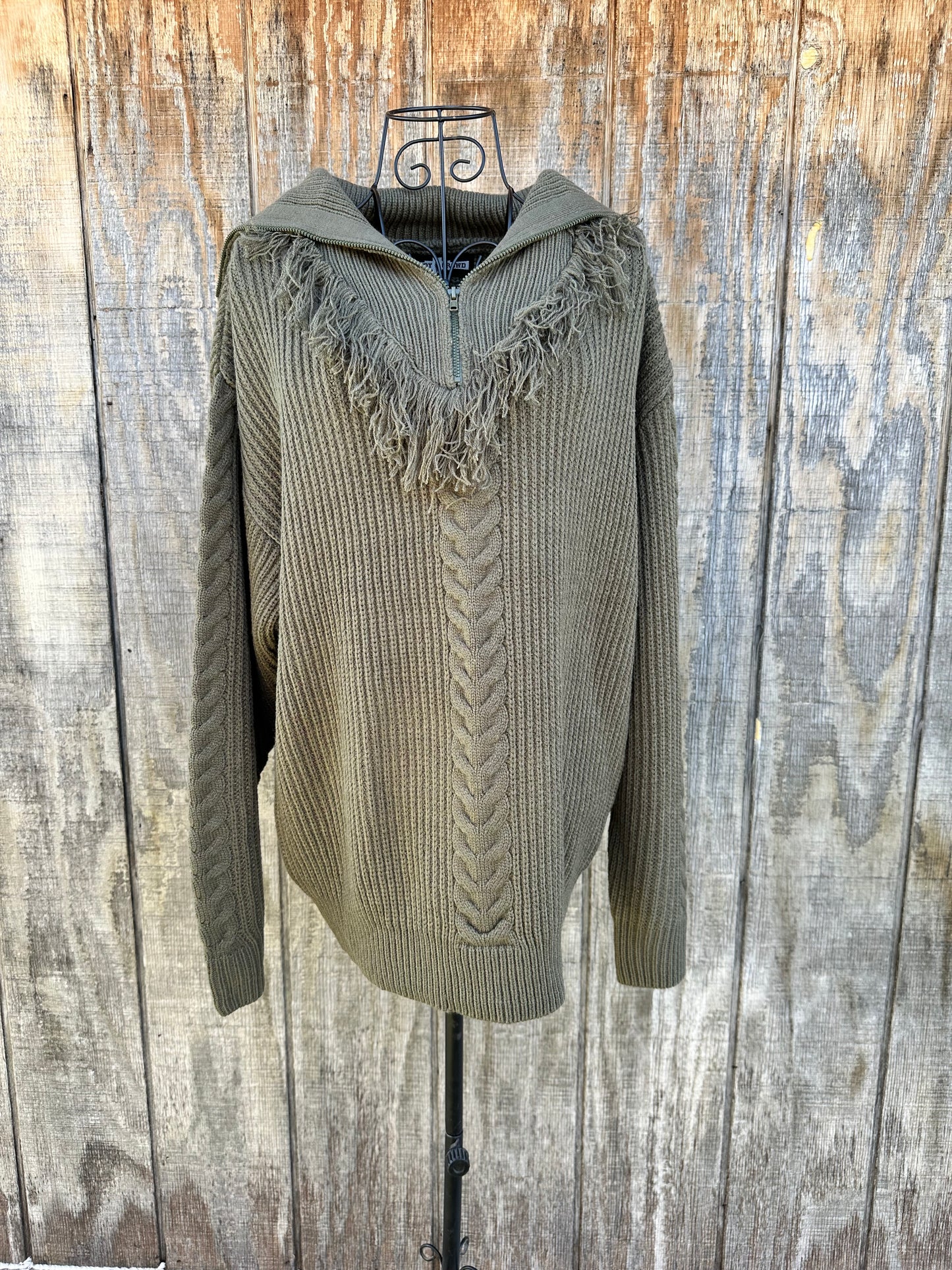 Olive green knit sweater with 3/4 zip and braided detailing