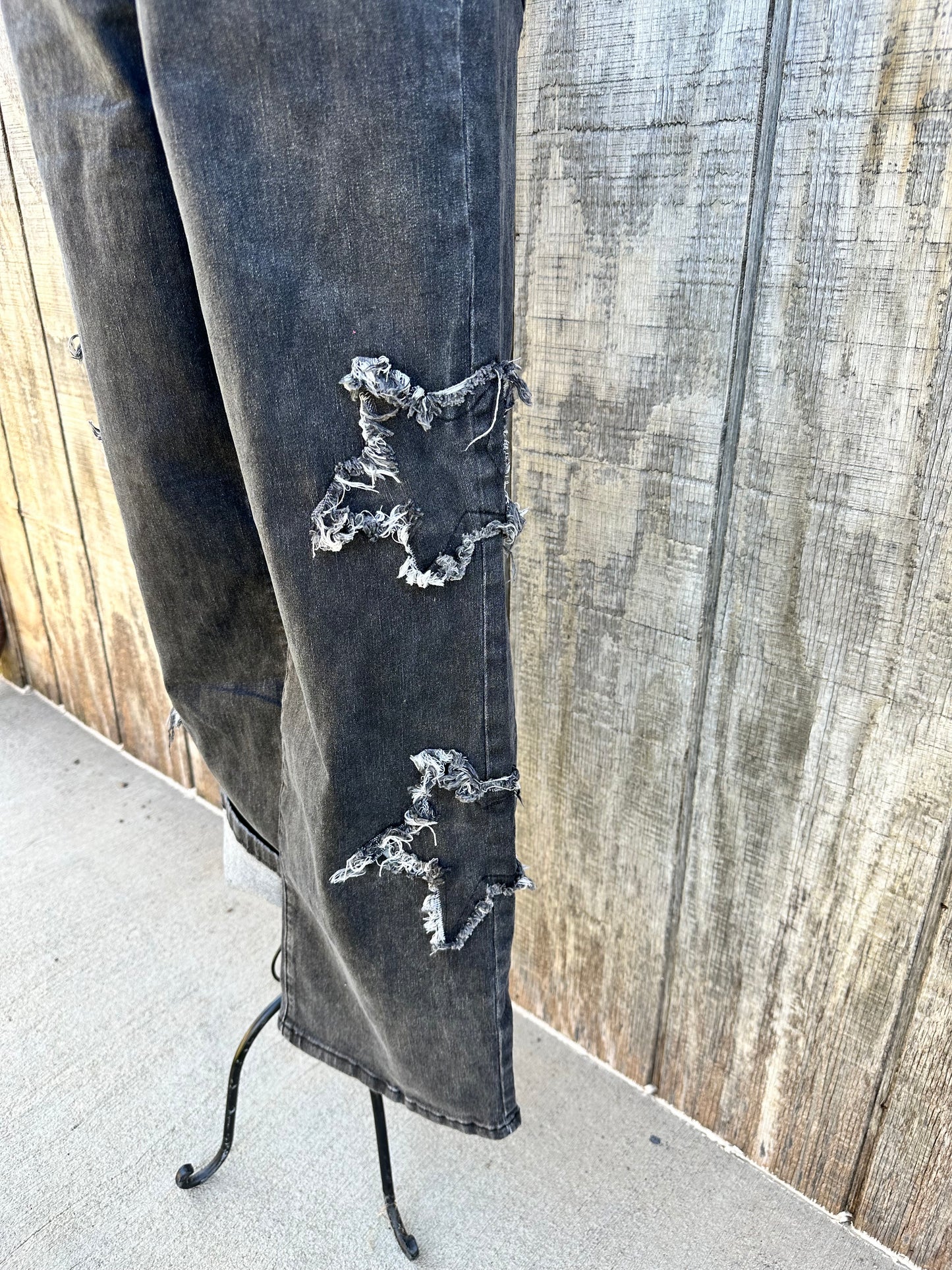 Close up of star patches on the left leg
