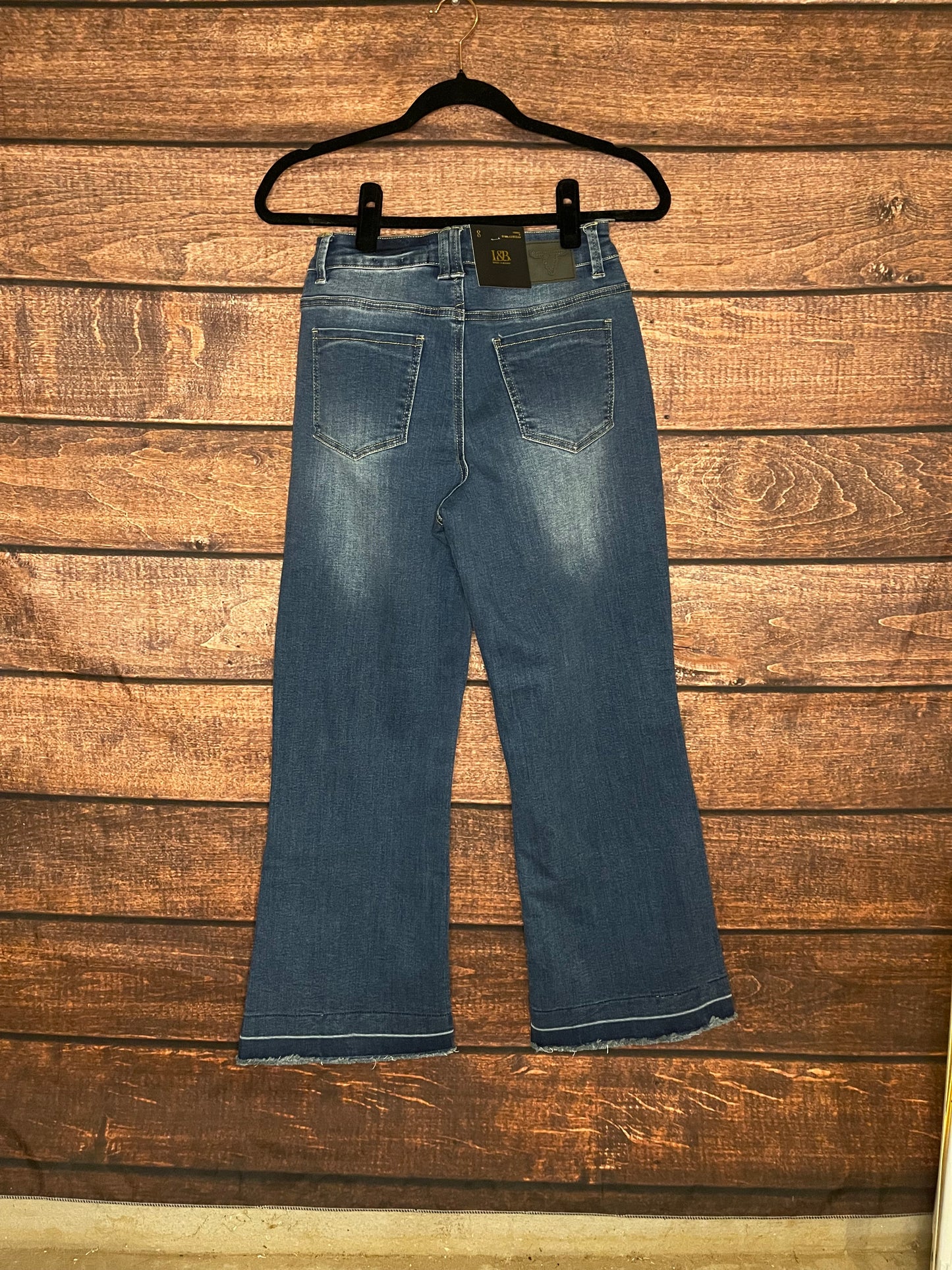 Back of mid-high rise, dark wash, wide leg denim capri pants