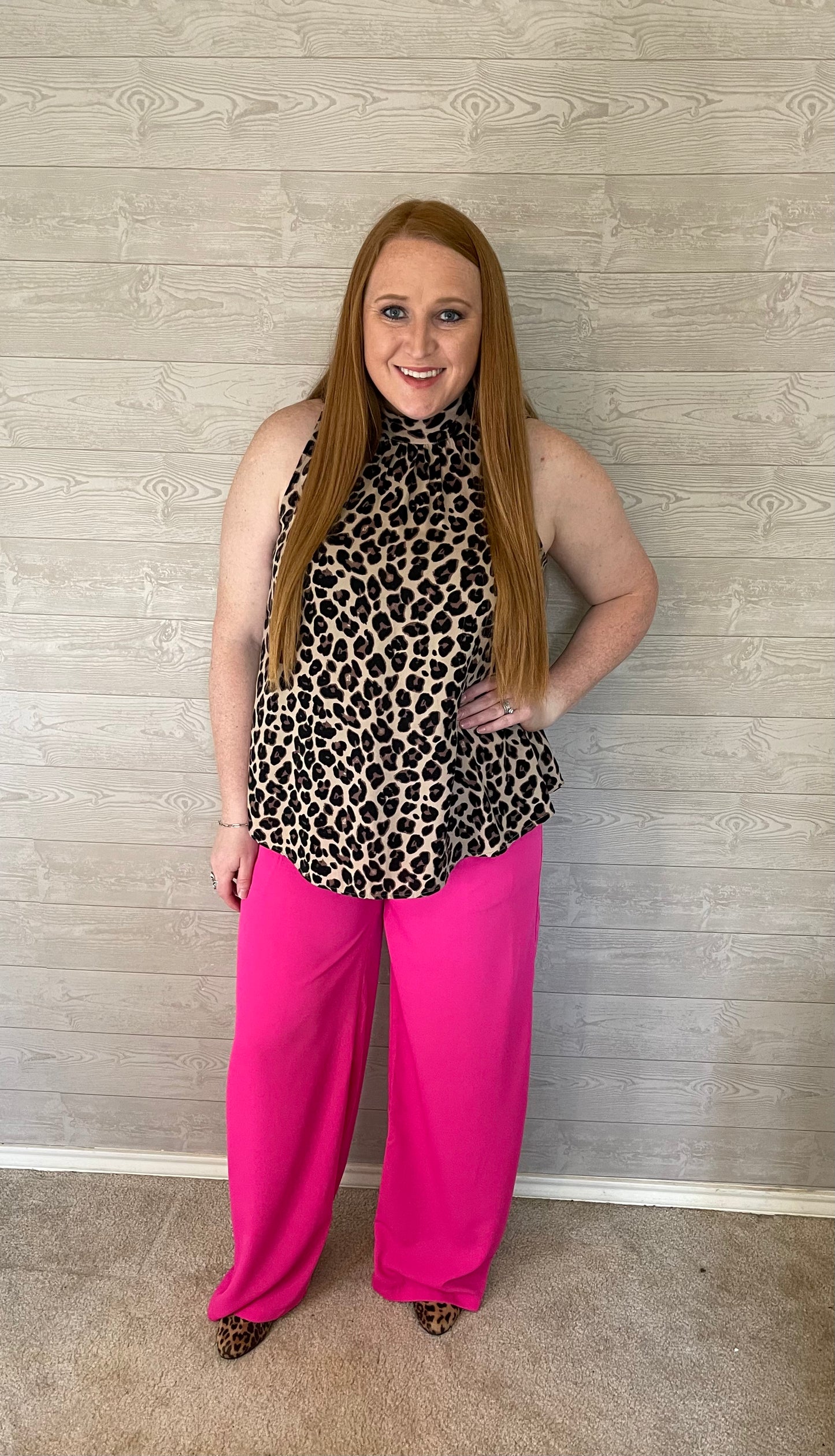 Model wearing Pink wide leg pants with cheetah print top and cheetah print boots