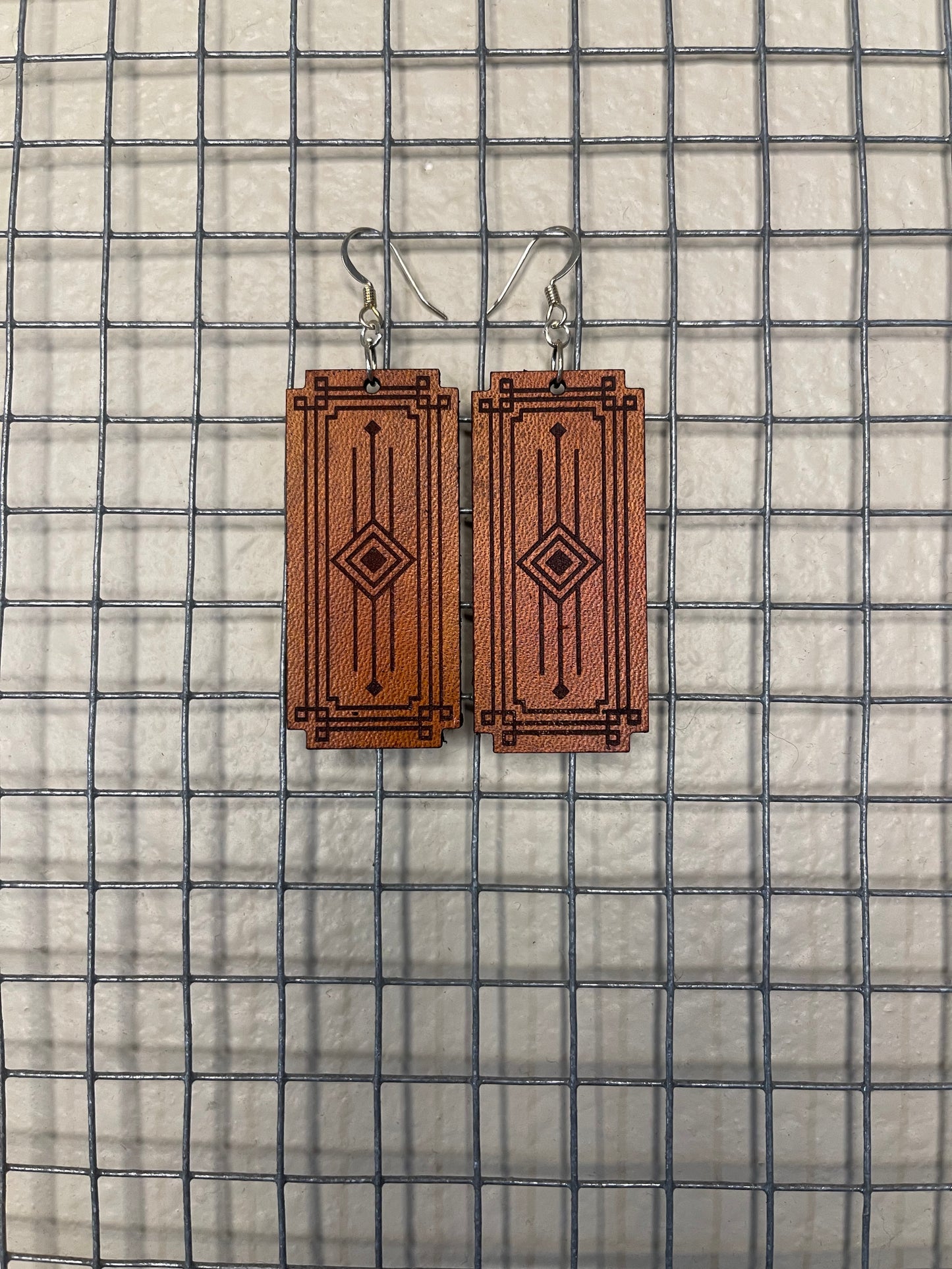 Lightweight leather dangle earrings with detailing