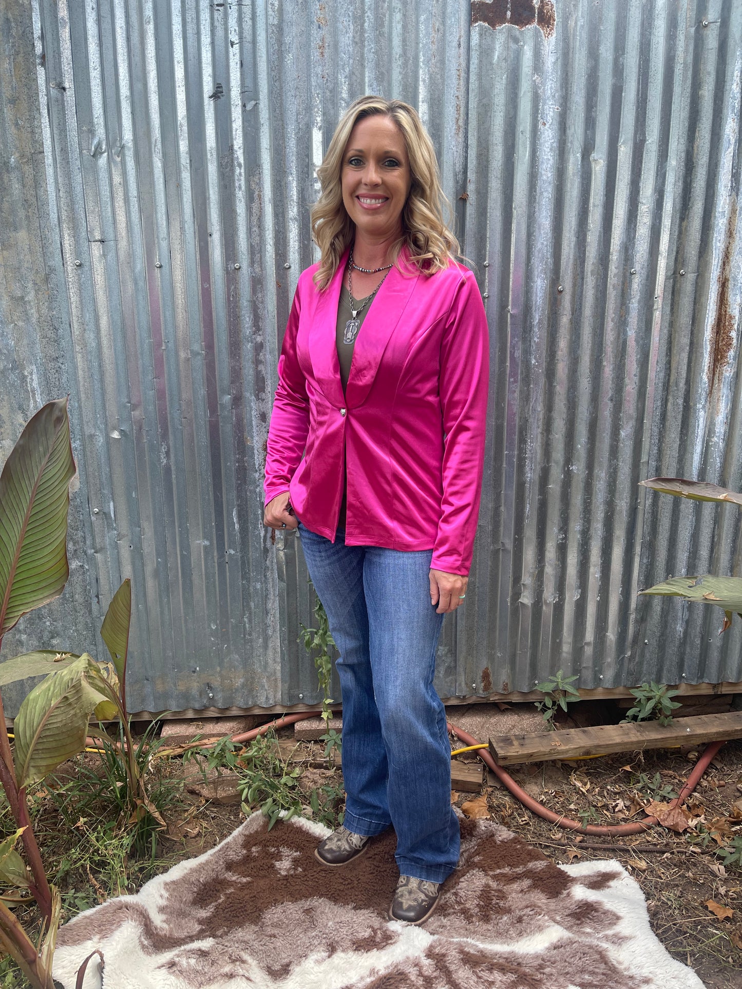 Woman wearing silky, hot pink blazer in size small