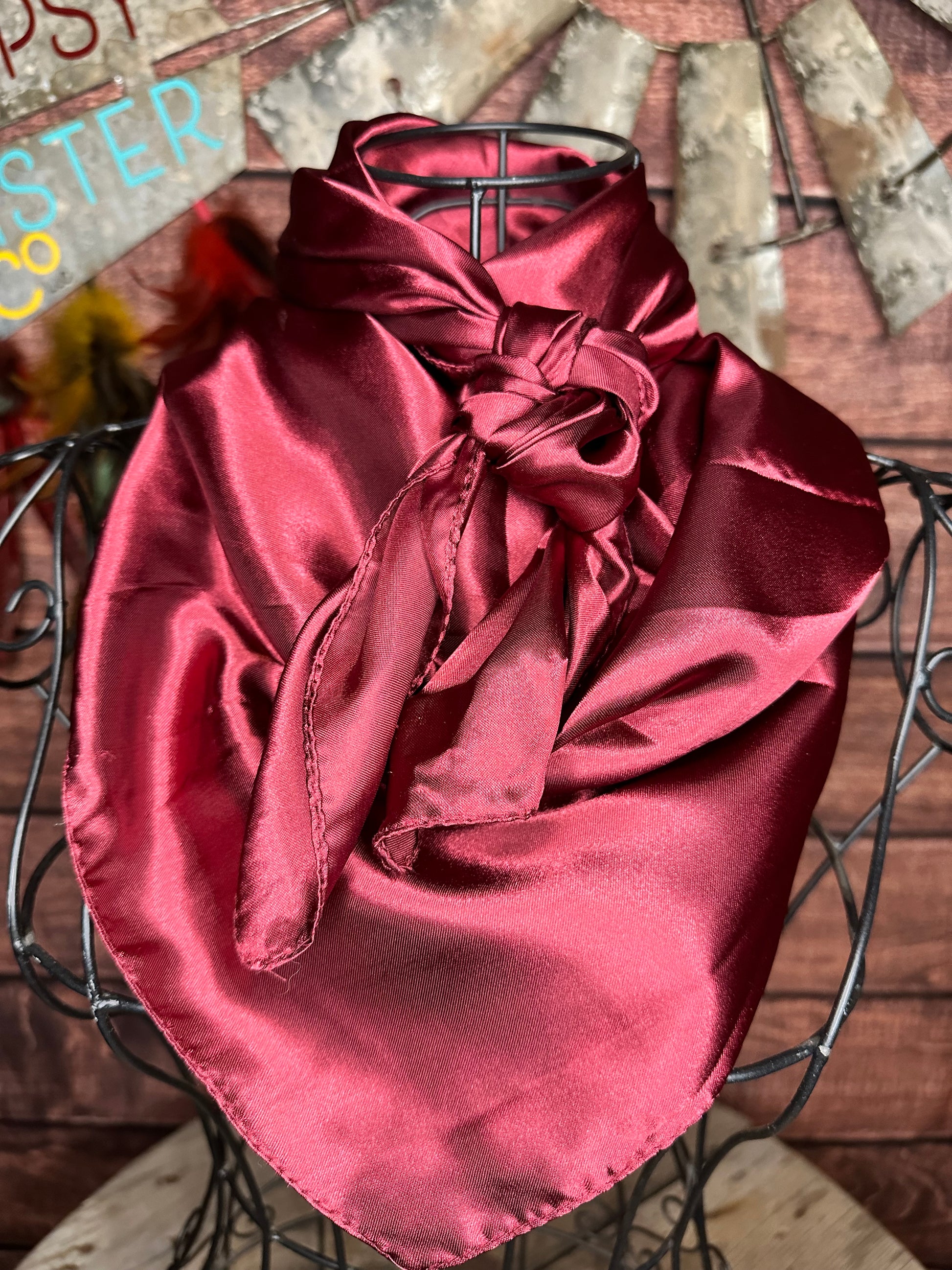 Burgundy silky wild rag tied on a mannequin 