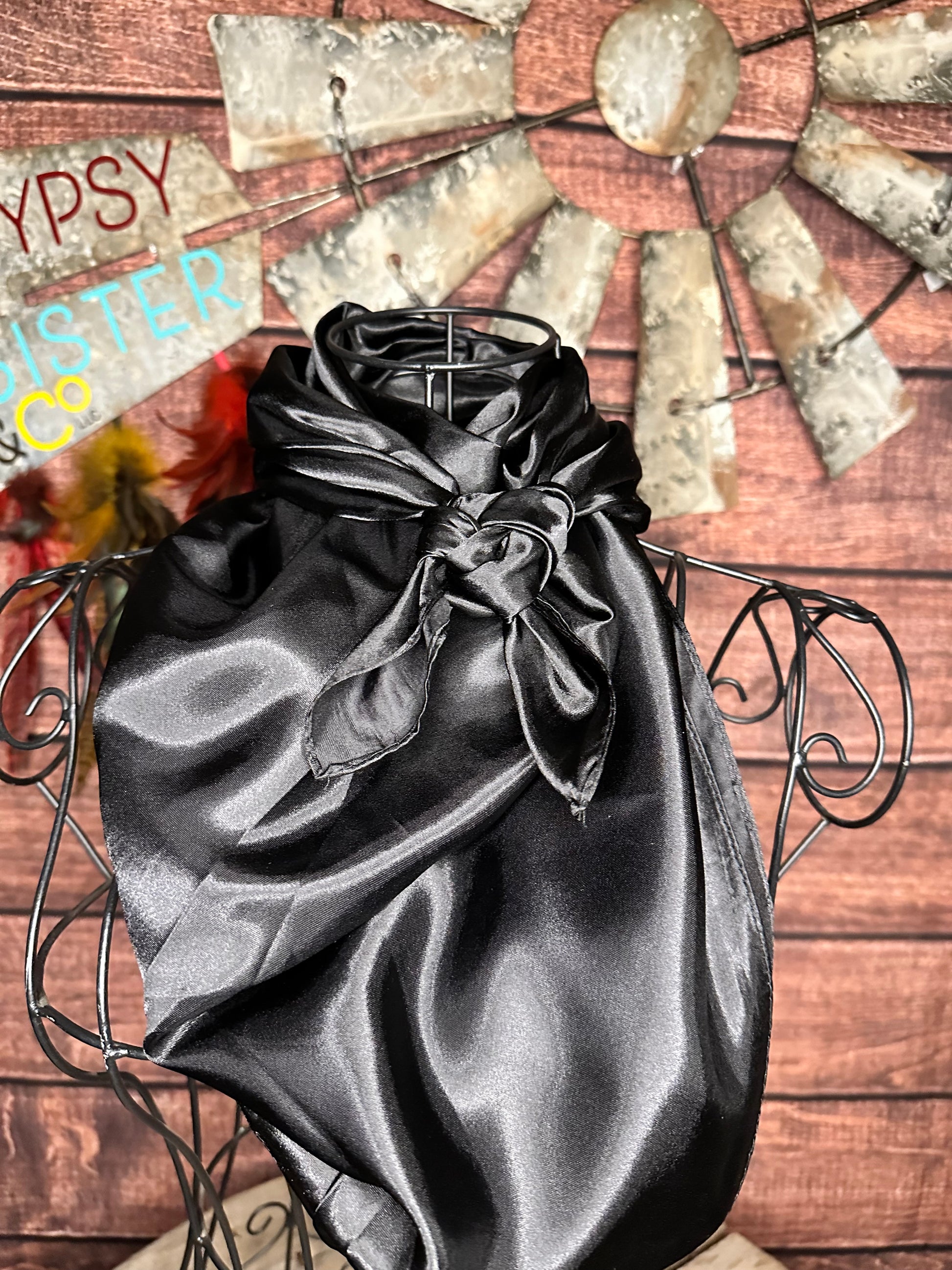 Black silky wild rag tied on a mannequin 