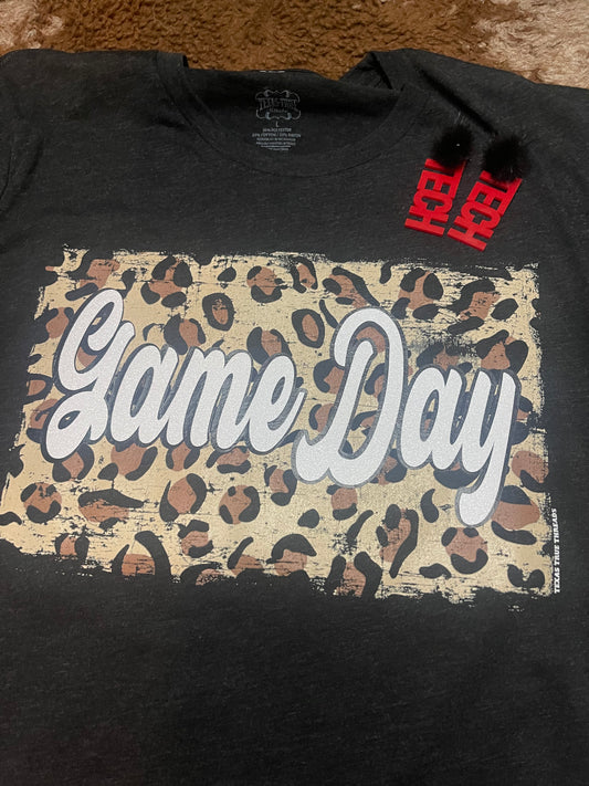Black t-shirt with Cheetah back ground and white glitter letters that spell out Game Day 