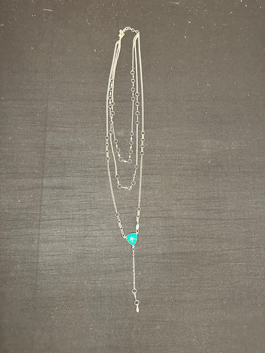 3 layered silver necklace with a turquoise stone 