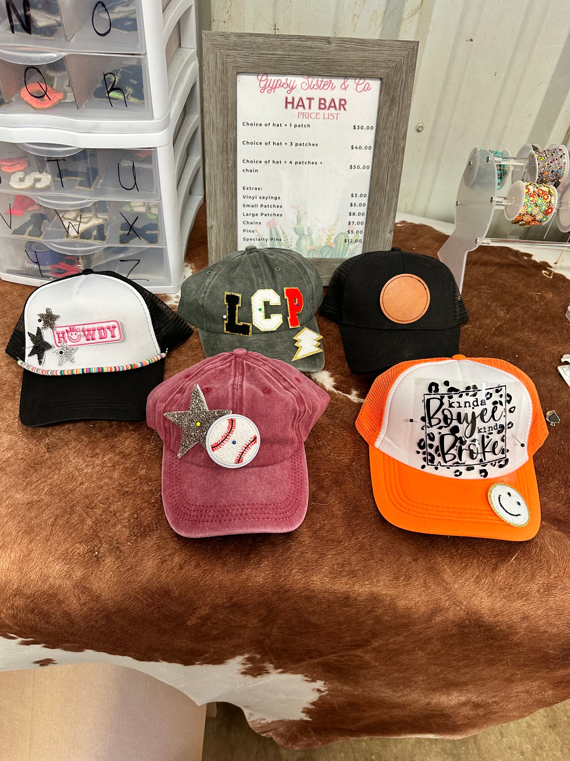 Examples of patches and vinyl satins on hats