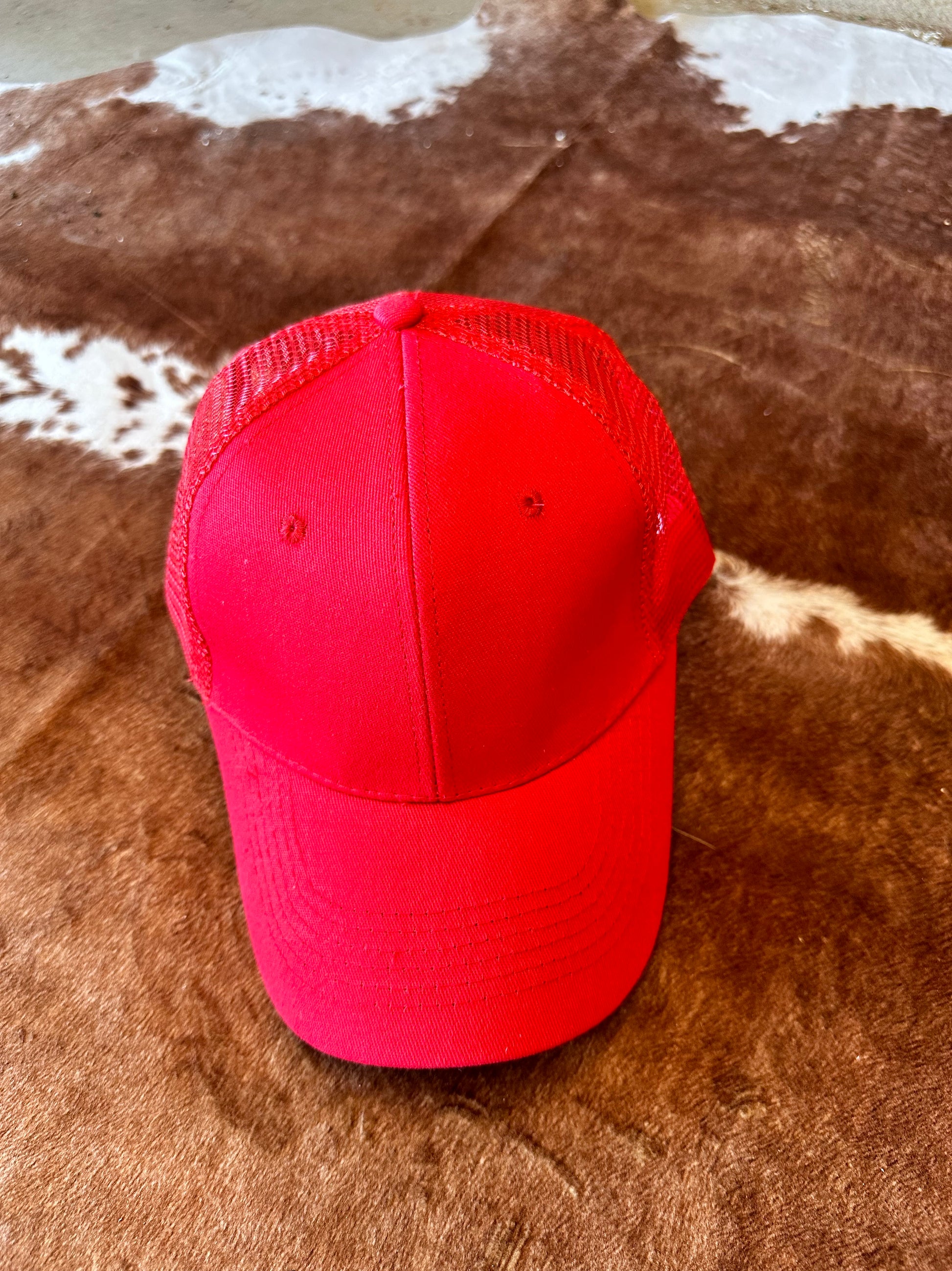 Red ball cap with structured crown and mesh back