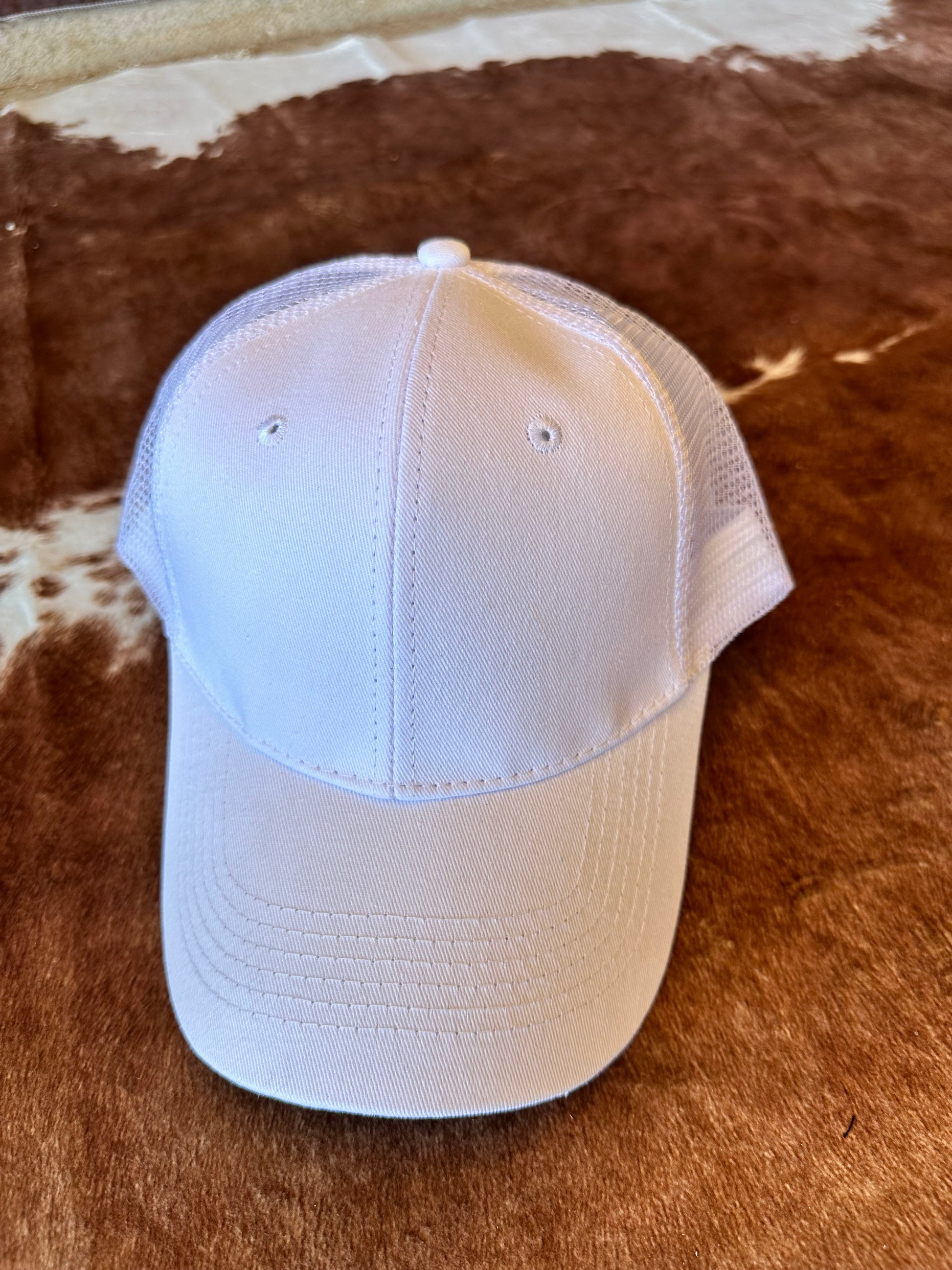 White ball cap with structured crown and mesh back