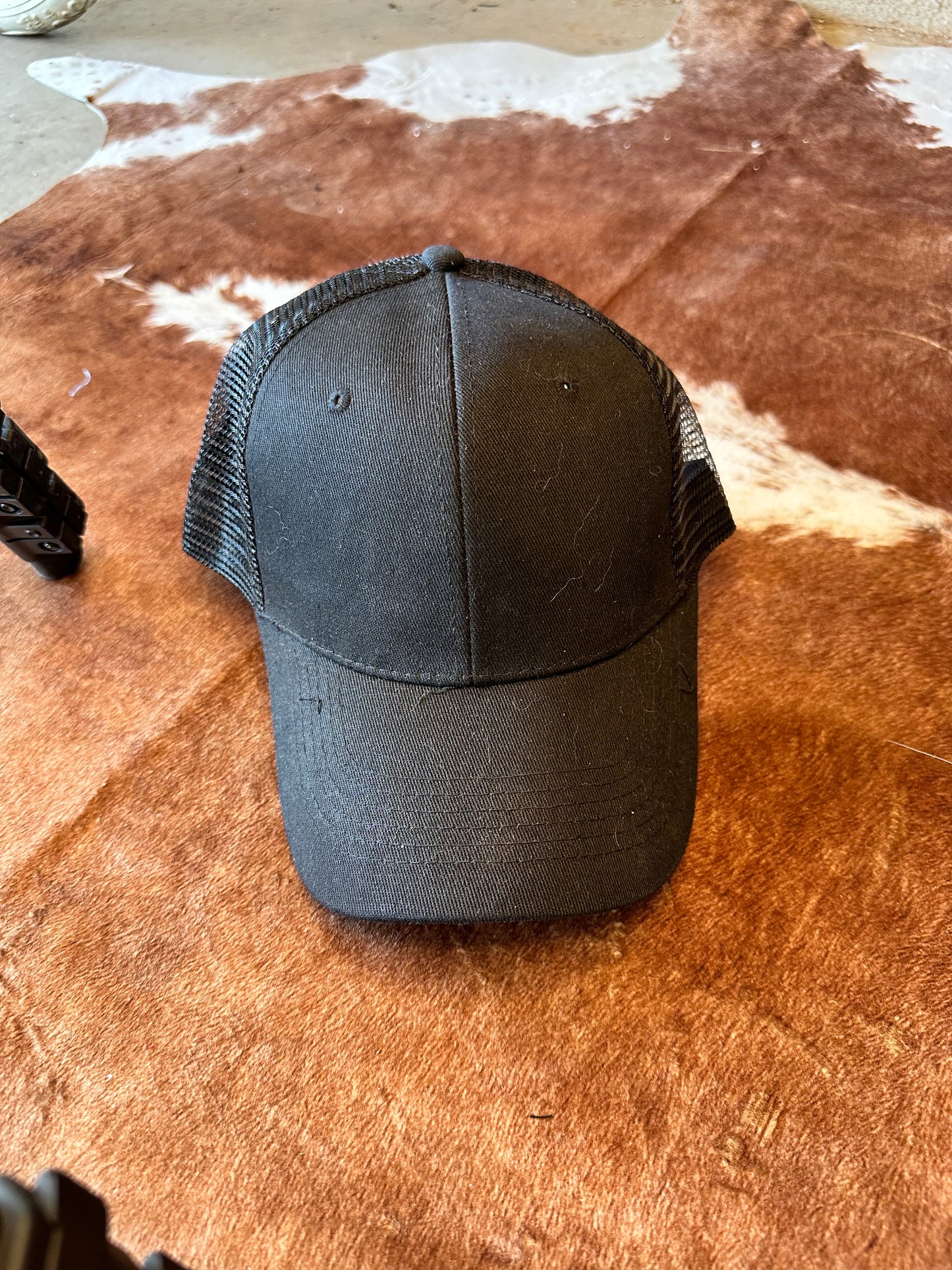 Black ball cap with structured crown and mesh back
