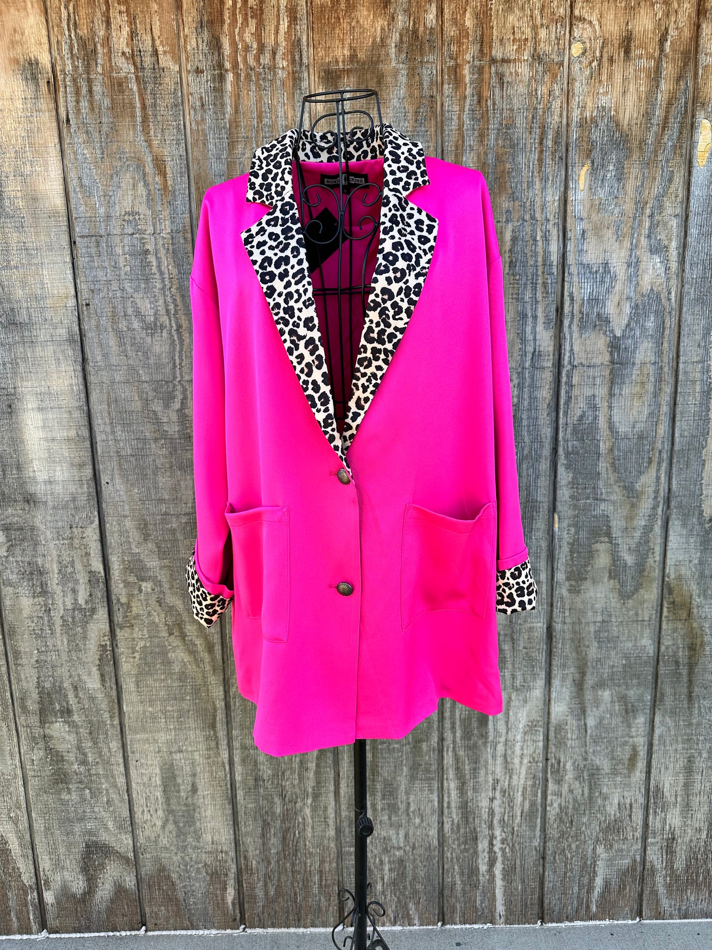 Hot pink Blazer with cheetah detailing on the collar and sleeves 