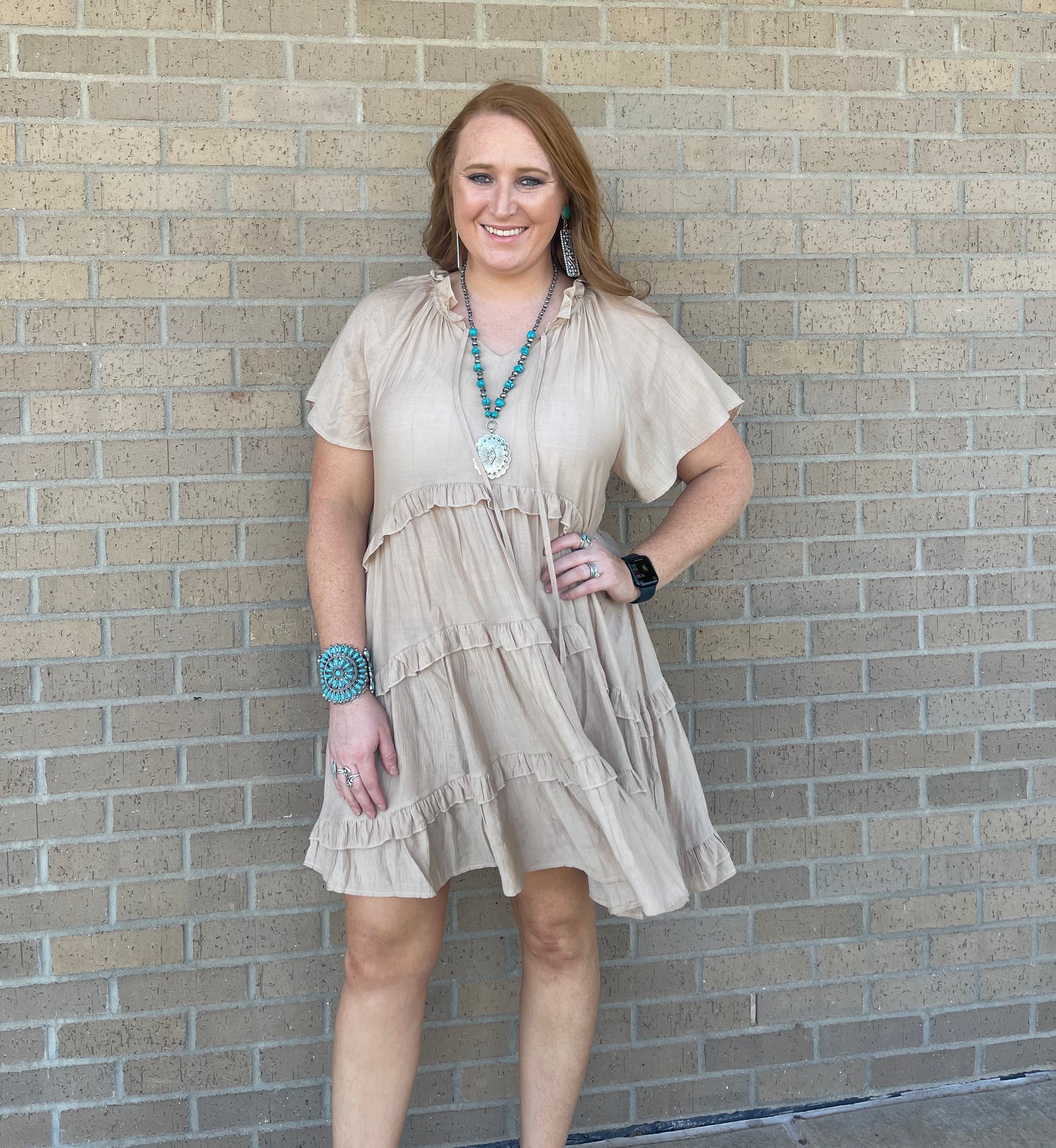 Model wearing ruffle tiered khaki dress 