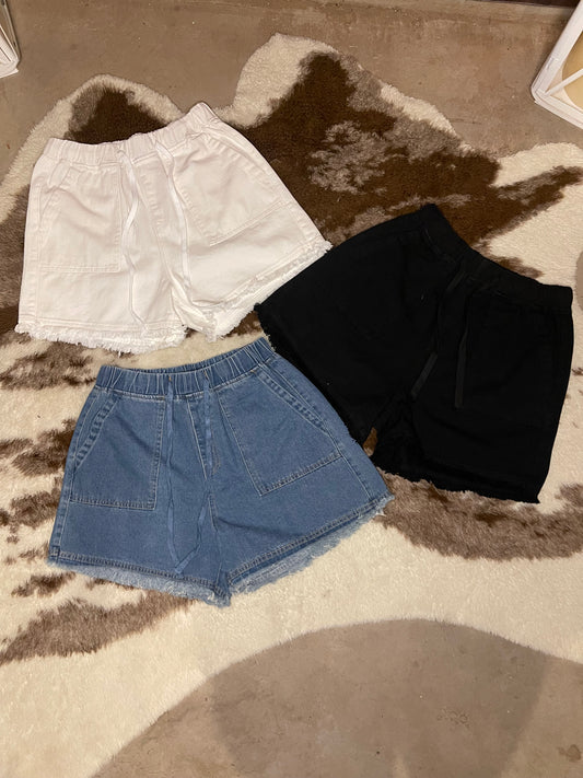 White, Black, & Denim casual shorts with elastic drawstring waist, and Frey hem