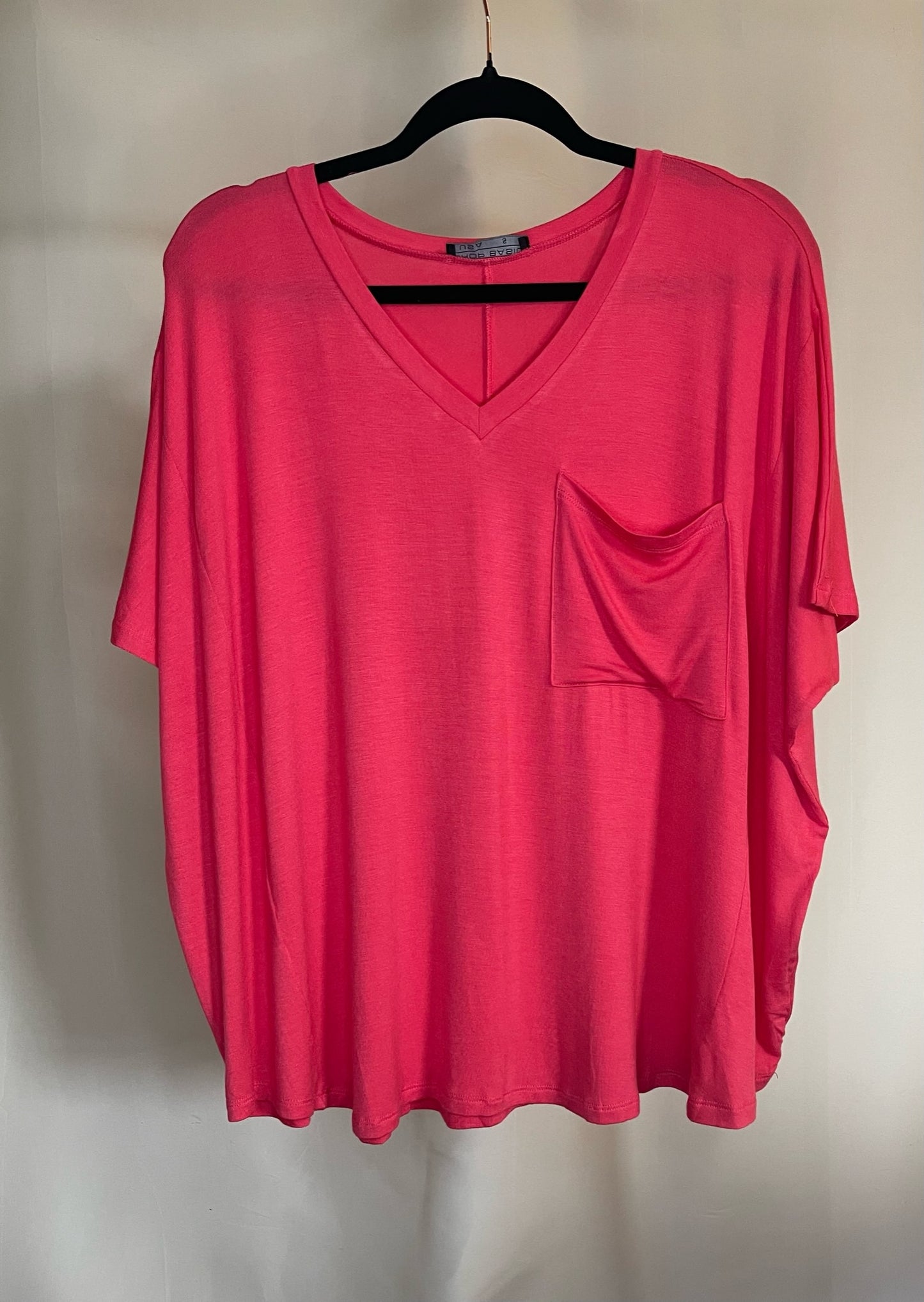 Oversized v-neck top with pocket in coral