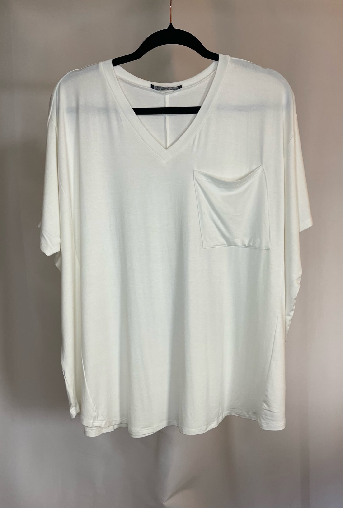 Oversized v-neck top with pocket in off white