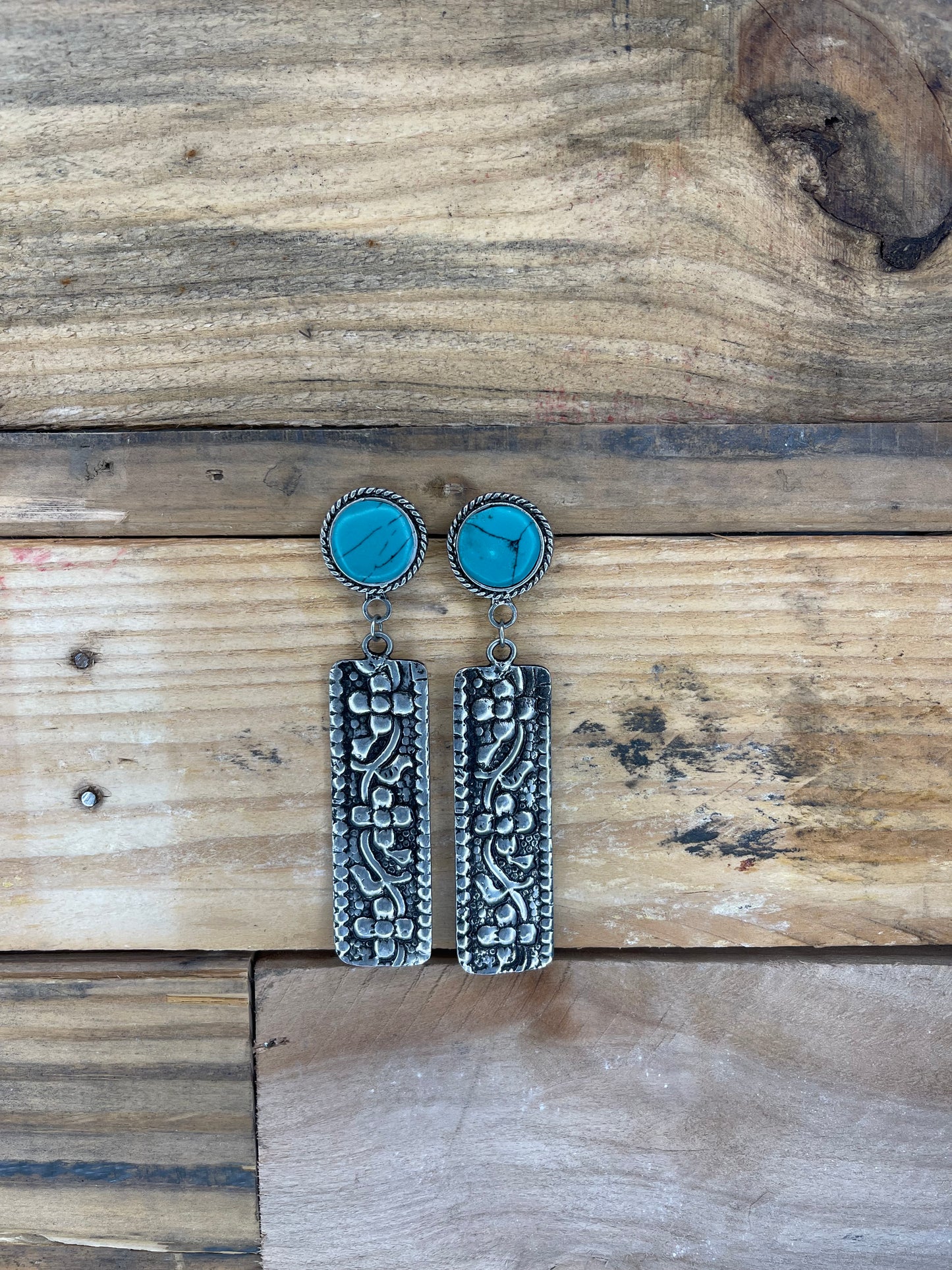 Earrings with round turquoise stone and tooled silver bar